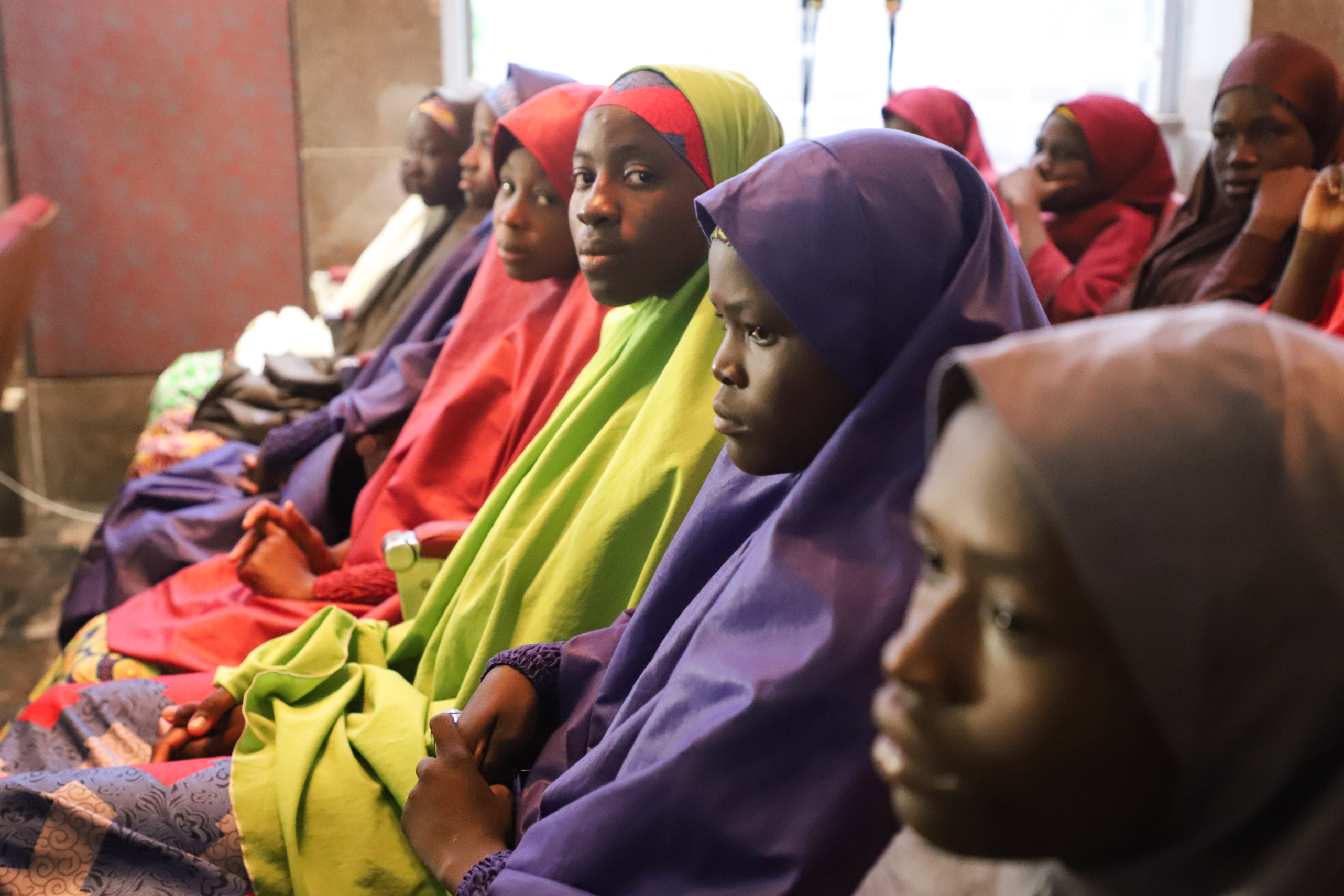 PHOTO: Released Nigerian school girls who were kidnapped from their school in Dapchi, in the northeastern state of Yobe, wait to meet the Nigerian president at the Presidential Villa in Abuja on March 23, 2018.