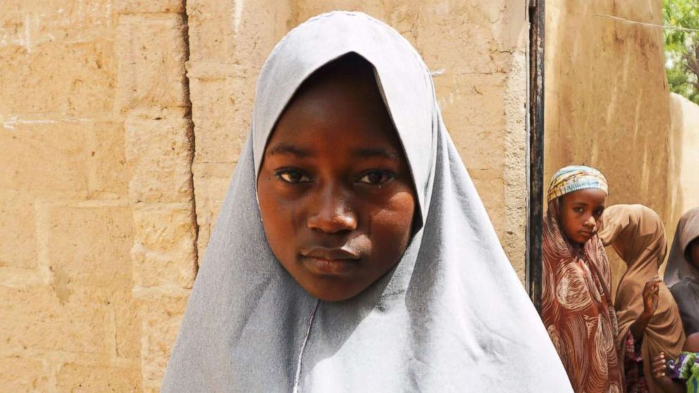PHOTO: Hassana Mohammed, 13, who scaled a fence to escape an alleged Boko Haram attack on her Government Girls Science and Technical College, stands outside her home in Dapchi, Nigeria, Feb. 22, 2018.