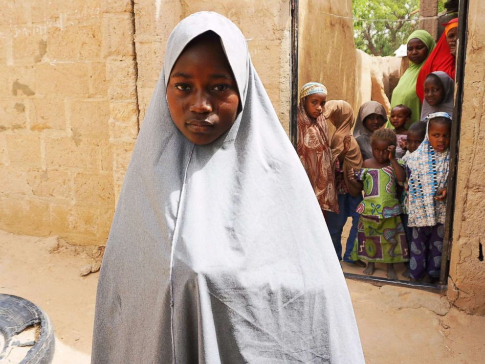 PHOTO: Hassana Mohammed, 13, who scaled a fence to escape an alleged Boko Haram attack on her Government Girls Science and Technical College, stands outside her home in Dapchi, Nigeria, Feb. 22, 2018.