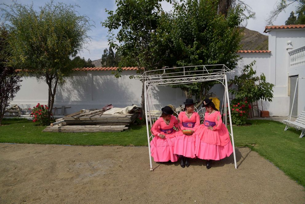 PHOTO: Members of a morenada dance fraternity shoot a music video at a cottage in the village of Lipari, on the outskirts of La Paz, Bolivia December 11, 2016.