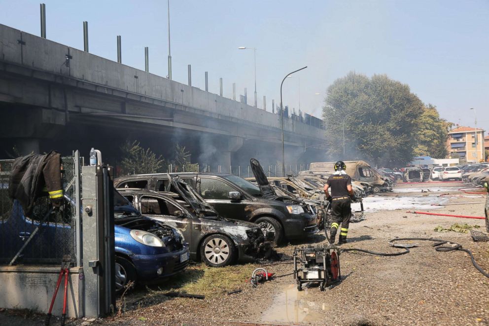 PHOTO: A firefighter walks past a line of burned vehicles following a road accident near Bologna, Italy, Aug. 6, 2018.