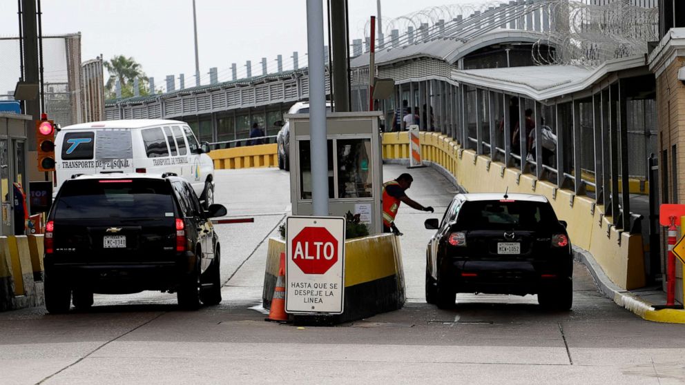 PHOTO: Vehicles cross over to Mexico at the Gateway International Bridge, March 20, 2020, in Brownsville, Texas.