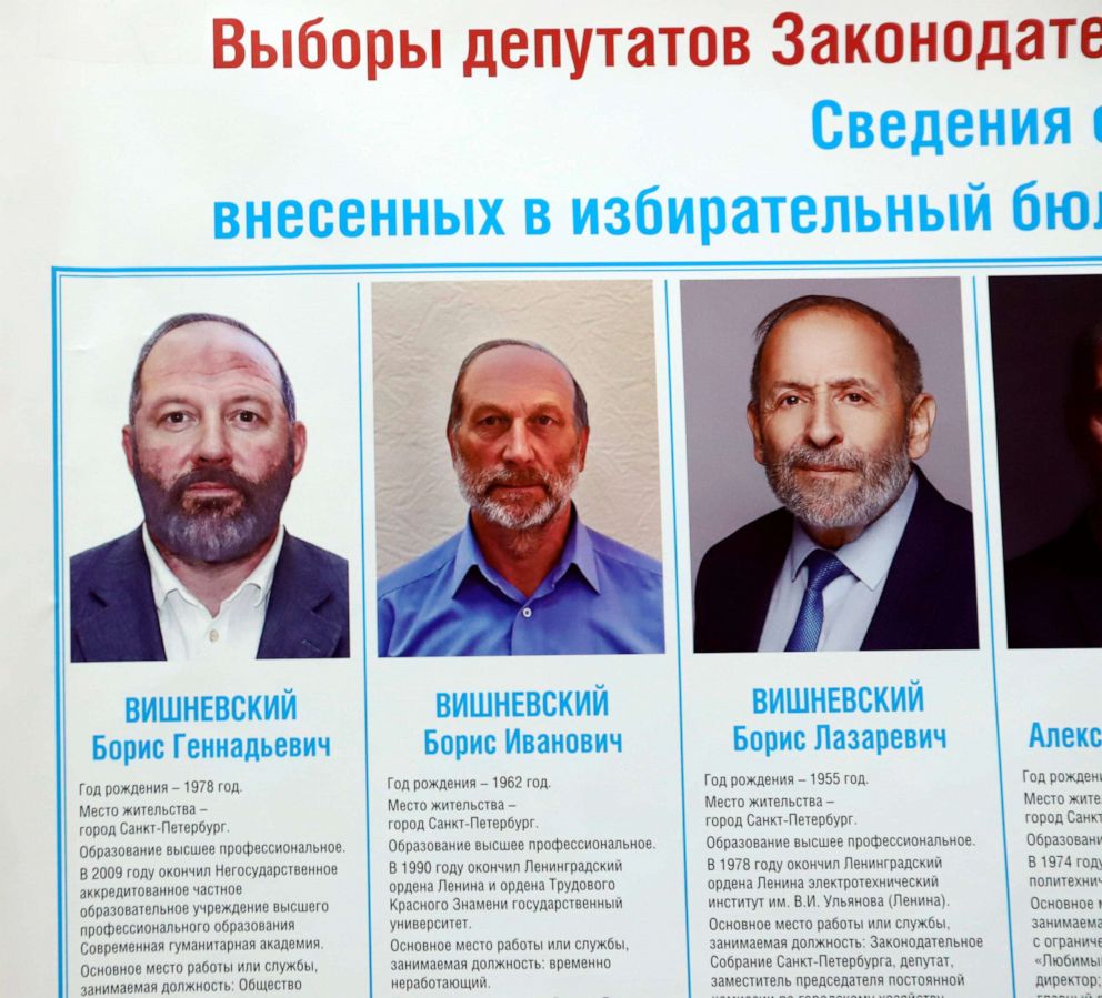 PHOTO: A candidate from the Yabloko party named Boris Vishnevsky, right, who is running to retain his seat in the St. Petersburg?s legislative assembly, appears on a poster in the city.