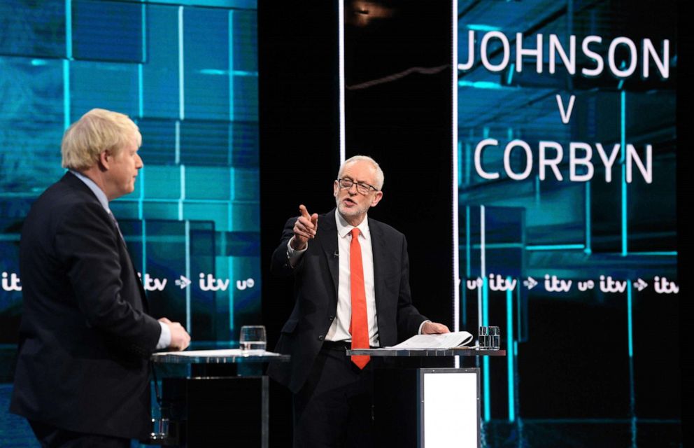 PHOTO: A handout picture taken and released by ITV on Nov. 19, 2019, shows Jeremy Corbyn and Prime Minister Boris Johnson as they debate on the set of "Johnson v Corbyn: The ITV Debate" in Salford, north-west England.