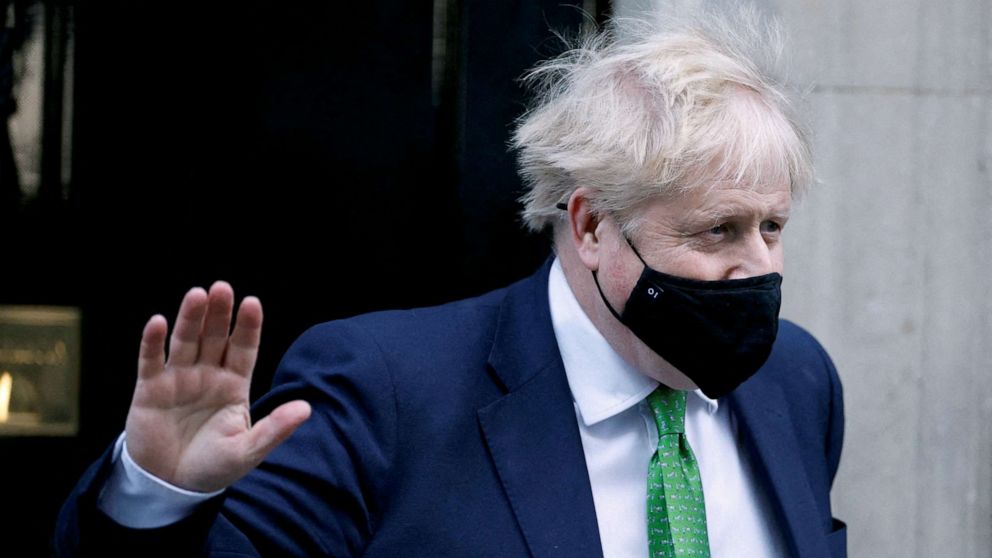 PHOTO: British Prime Minister Boris Johnson waves as he leaves Downing Street in London, Jan. 19, 2022.