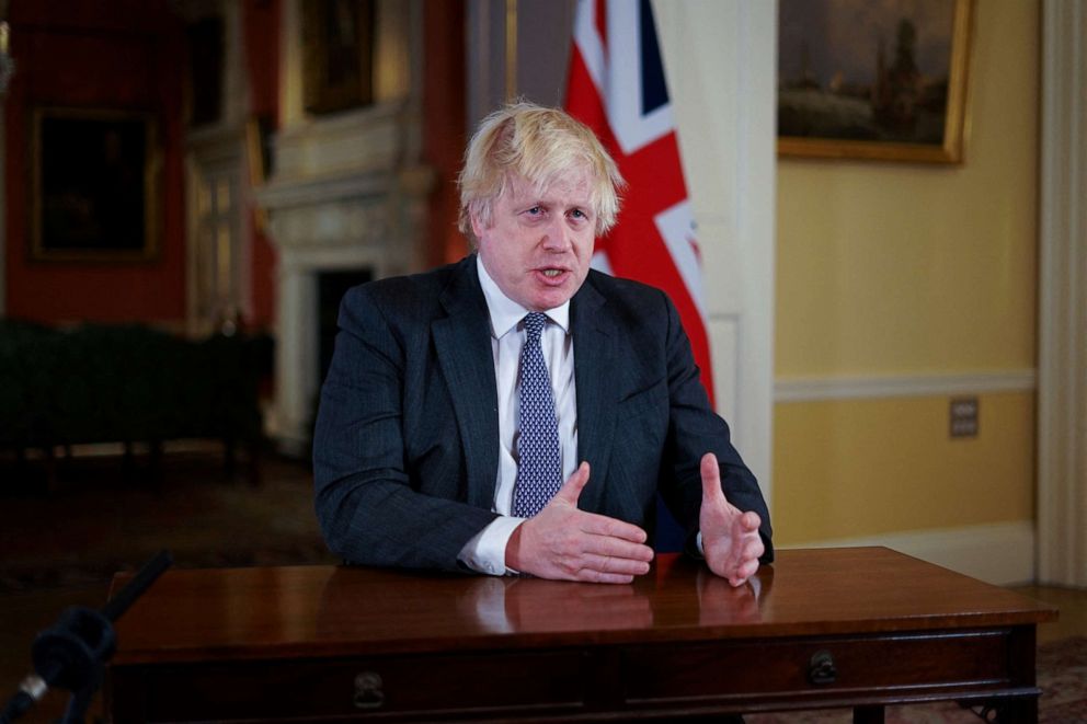 PHOTO: British Prime Minister Boris Johnson gestures as he records an address to the nation to provide an update on the booster COVID-19 vaccine program from Downing Street in London, United Kingdom, on Dec. 12, 2021.