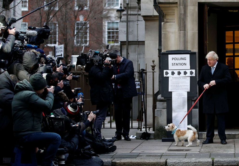 PHOTO: Britain's Prime Minister Boris Johnson arrives with his dog Dilyn at a polling station, at the Methodist Central Hall, to vote in the general election in London, England, Dec. 12, 2019.
