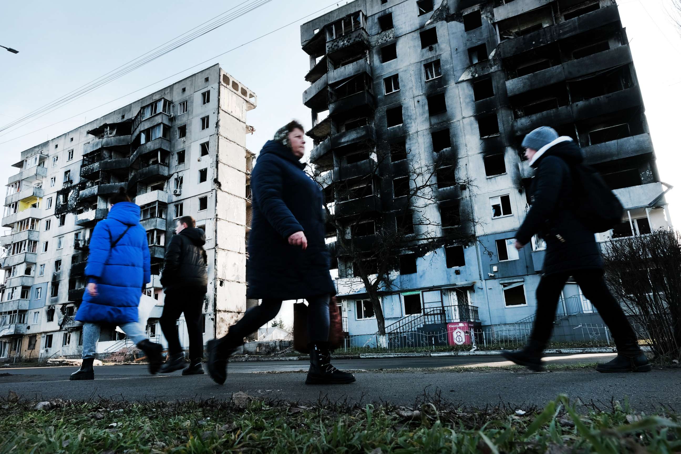 PHOTO: People walk through the partially destroyed town of Borodyanka on Jan. 2, 2023 in Borodyanka, Ukraine.