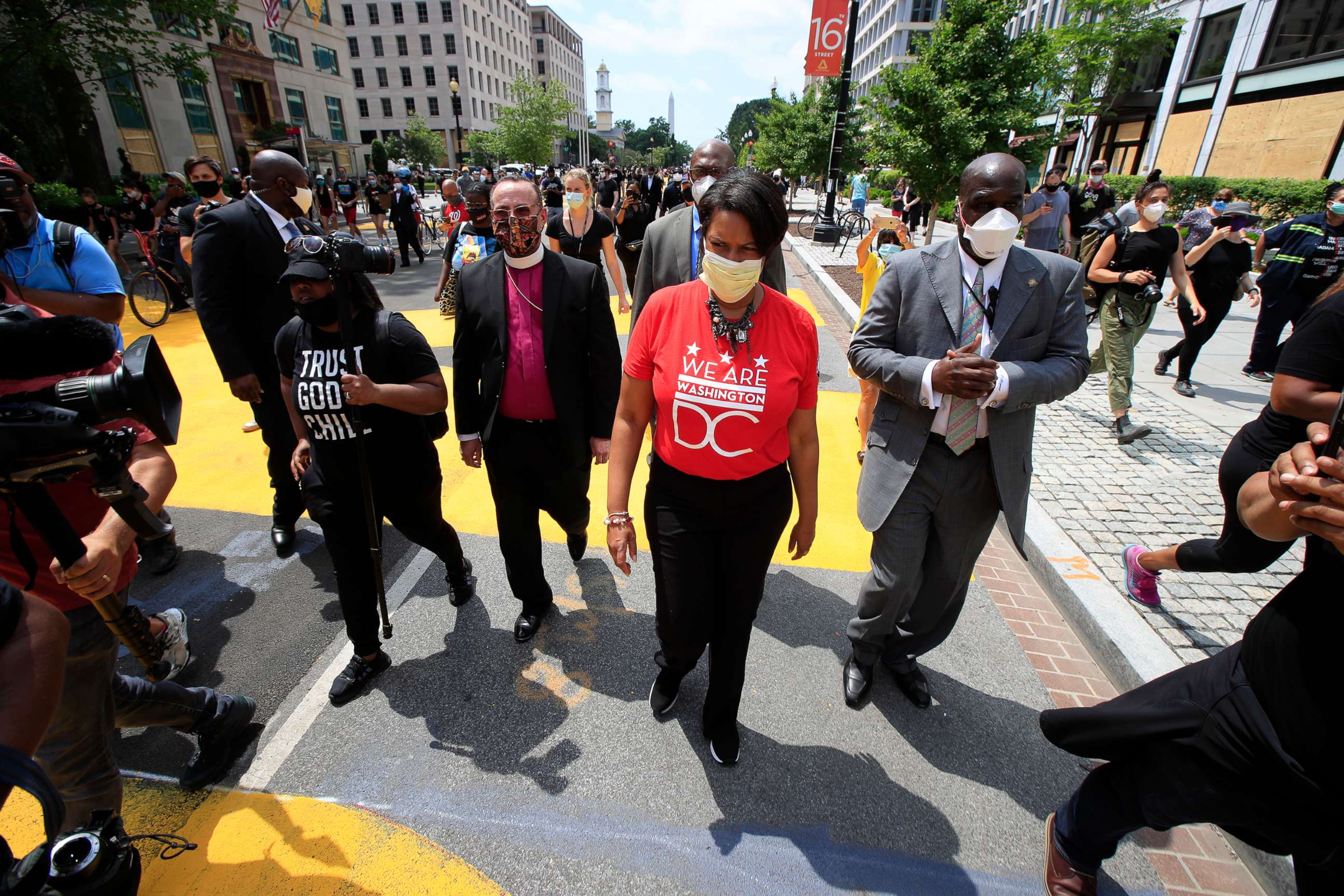 PHOTO: D.C. Mayor Muriel Bowser walks on the street leading to the White House after the words Black Lives Matter were painted in enormous bright yellow letters on the street by city workers and activists, June 5, 2020, in Washington.