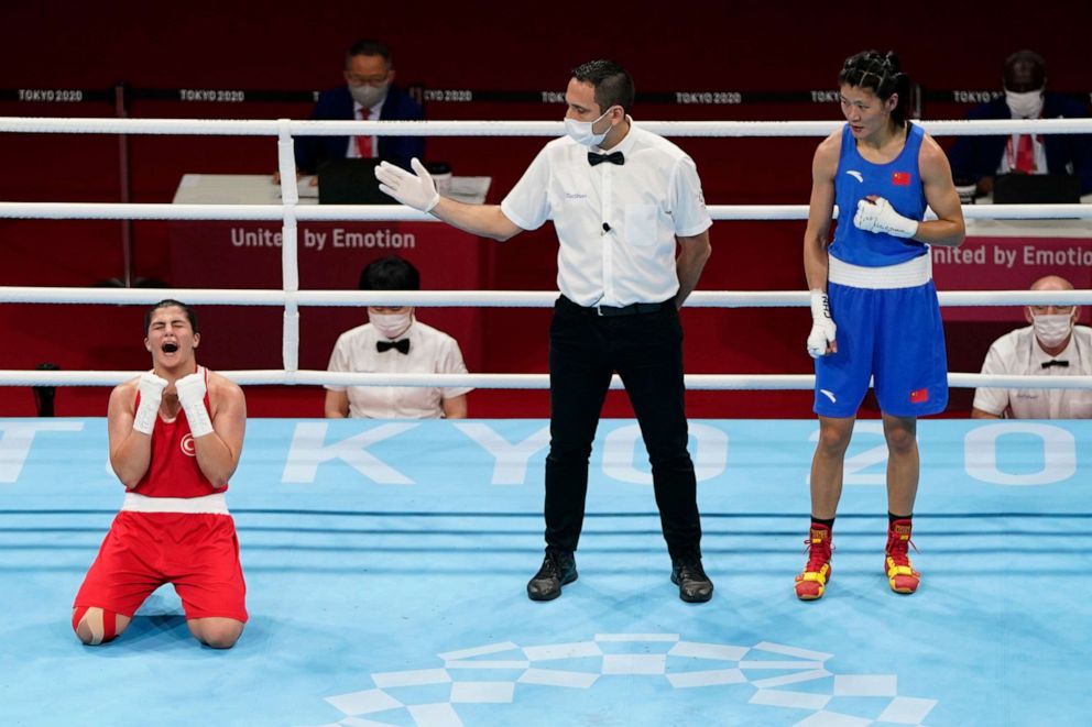 PHOTO: Turkey's Busenaz Surmeneli, left, reacts after defeating China's Cu Hong in their women's welterweight 69-kg boxing gold medal match at the 2020 Summer Olympics, Aug. 7, 2021, in Tokyo, Japan.