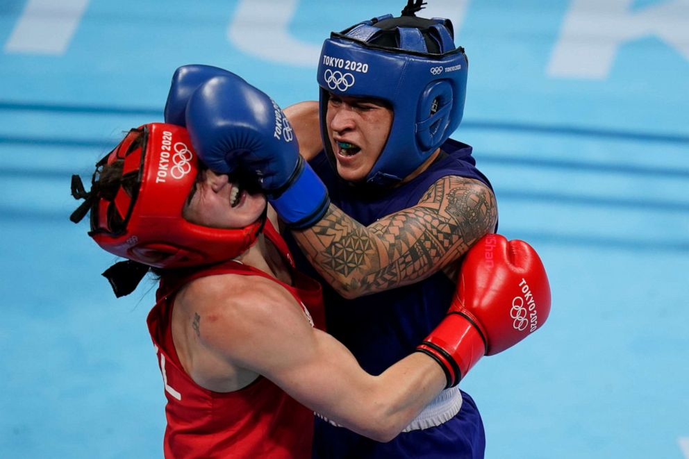 PHOTO: Ireland's Kellie Anne Harrington, left, exchanges punches with Brazil's Beatriz Ferreira during their women's lightweight 60-kg boxing gold medal match at the 2020 Summer Olympics, Aug. 8, 2021, in Tokyo, Japan.