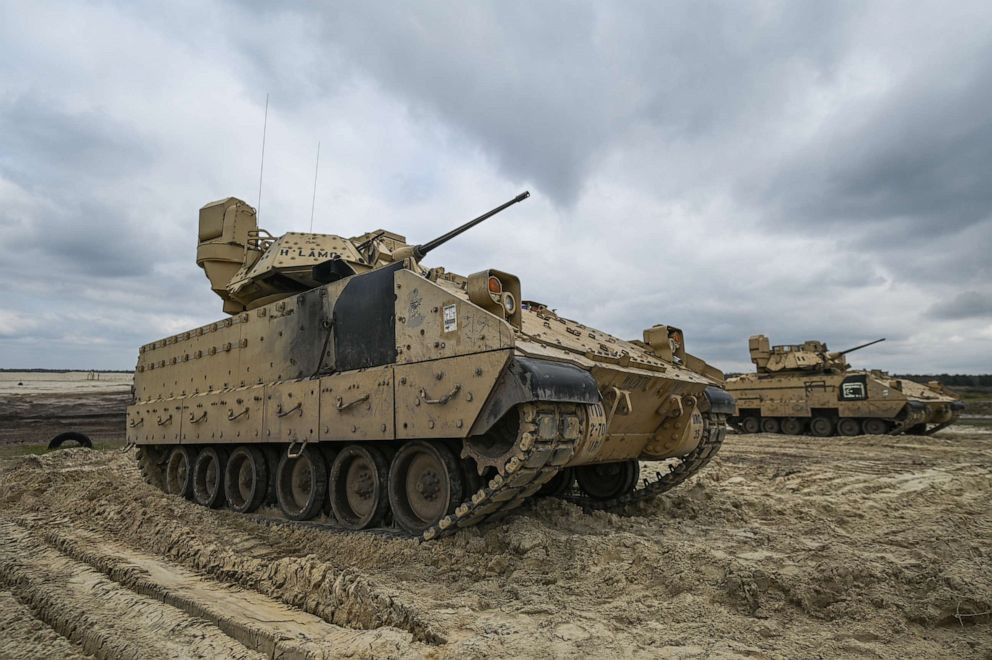 PHOTO: American soldiers of the 2nd Battalion, 70th Armor Regiment, 2nd Armored Brigade Comat Team, 1st Infantry Division supporting the 4th Infantry Division are seen during a training session utilizing Bradley Fighting Vehicle in Poland, April 12, 2023.