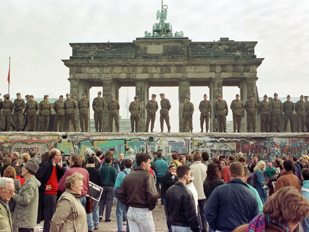 PHOTO: In this file photo, East Berlin border guards stand atop the Berlin Wall in front of the Brandenburg Gate, Nov. 11, 1989.