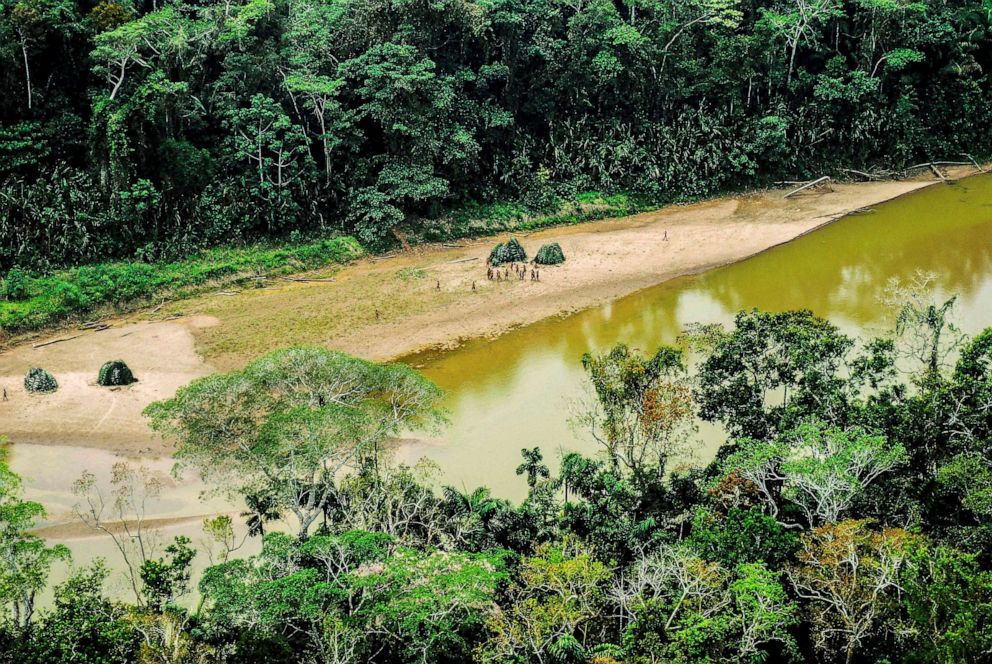 PHOTO: An undated image shows an aerial view of indigenous people gathered by a riverbank in the Peruvian Amazon.