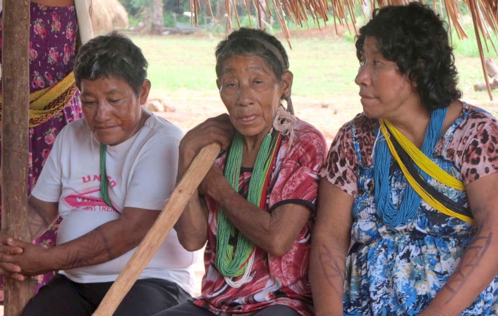 PHOTO: Tatjig, Iogo and Typu Arara. Iogo, the oldest woman of the community, sits at the center.