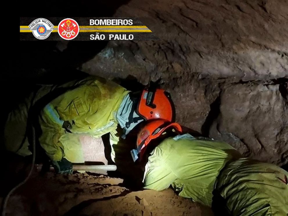 PHOTO: Sao Paulo State's Military Police on October 31, 2021 showing firefighters working to rescue civilian firefighters buried in a cave after a collapse in Altinopolis, Sao Paulo state, Brazil. Photo by Sao Paulo State's Military Police / AFP