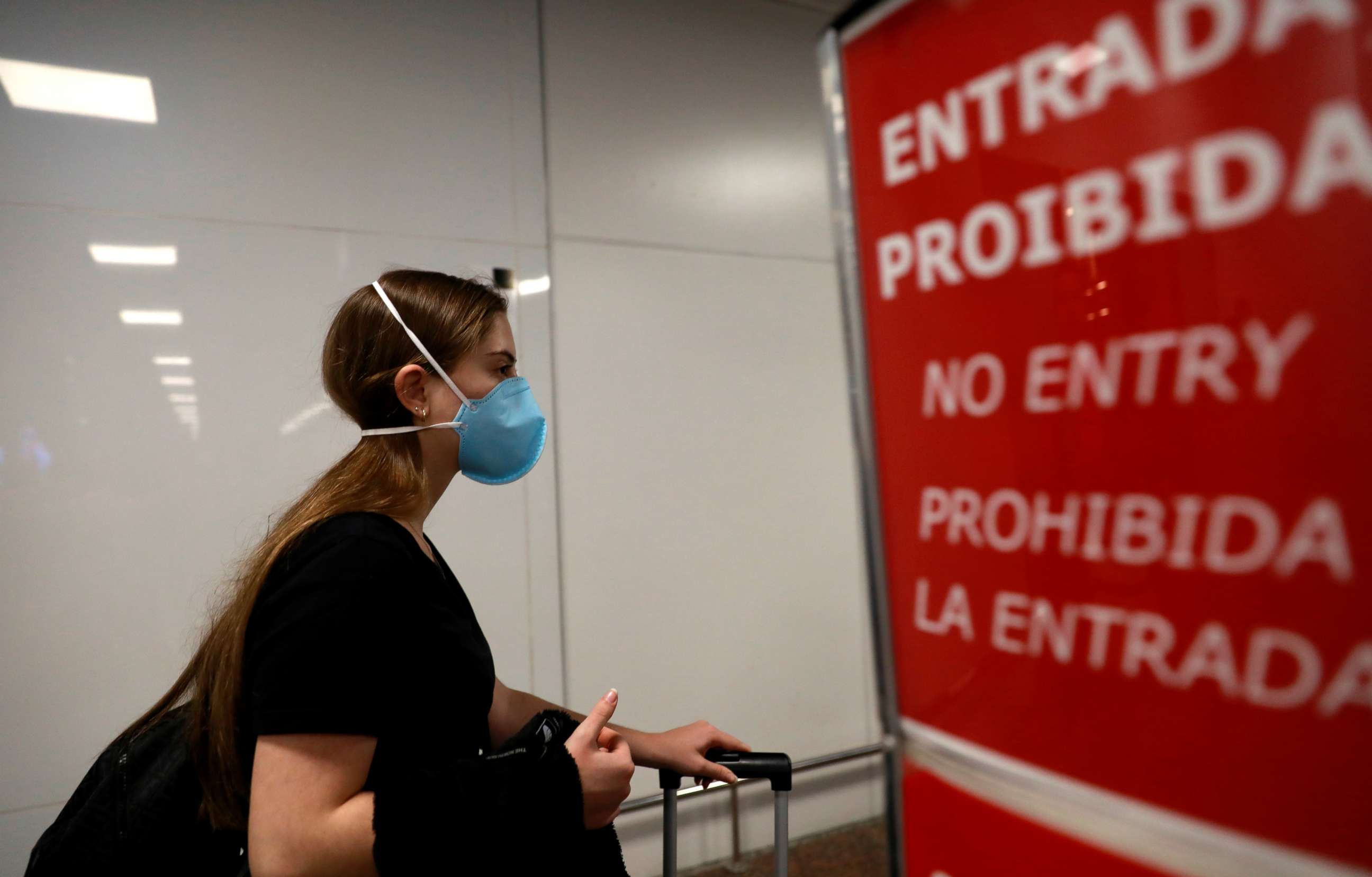 PHOTO: A traveler, wears a mask as a precautionary measure due to the coronavirus, is seen at Salgado Filho airport in Porto Alegre, Brazil, Feb. 27, 2020.