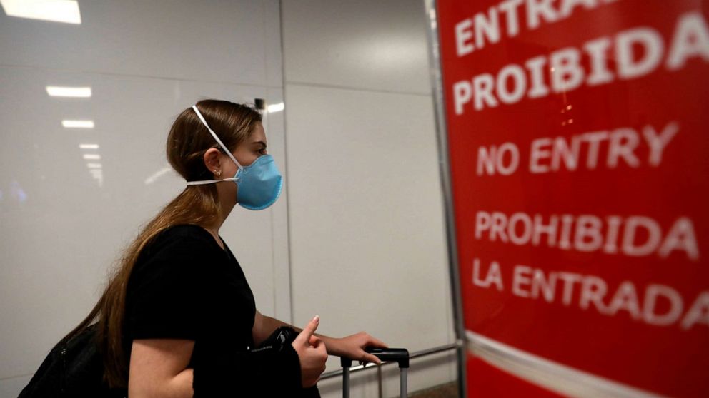 PHOTO: A traveler, wears a mask as a precautionary measure due to the coronavirus, is seen at Salgado Filho airport in Porto Alegre, Brazil, Feb. 27, 2020.