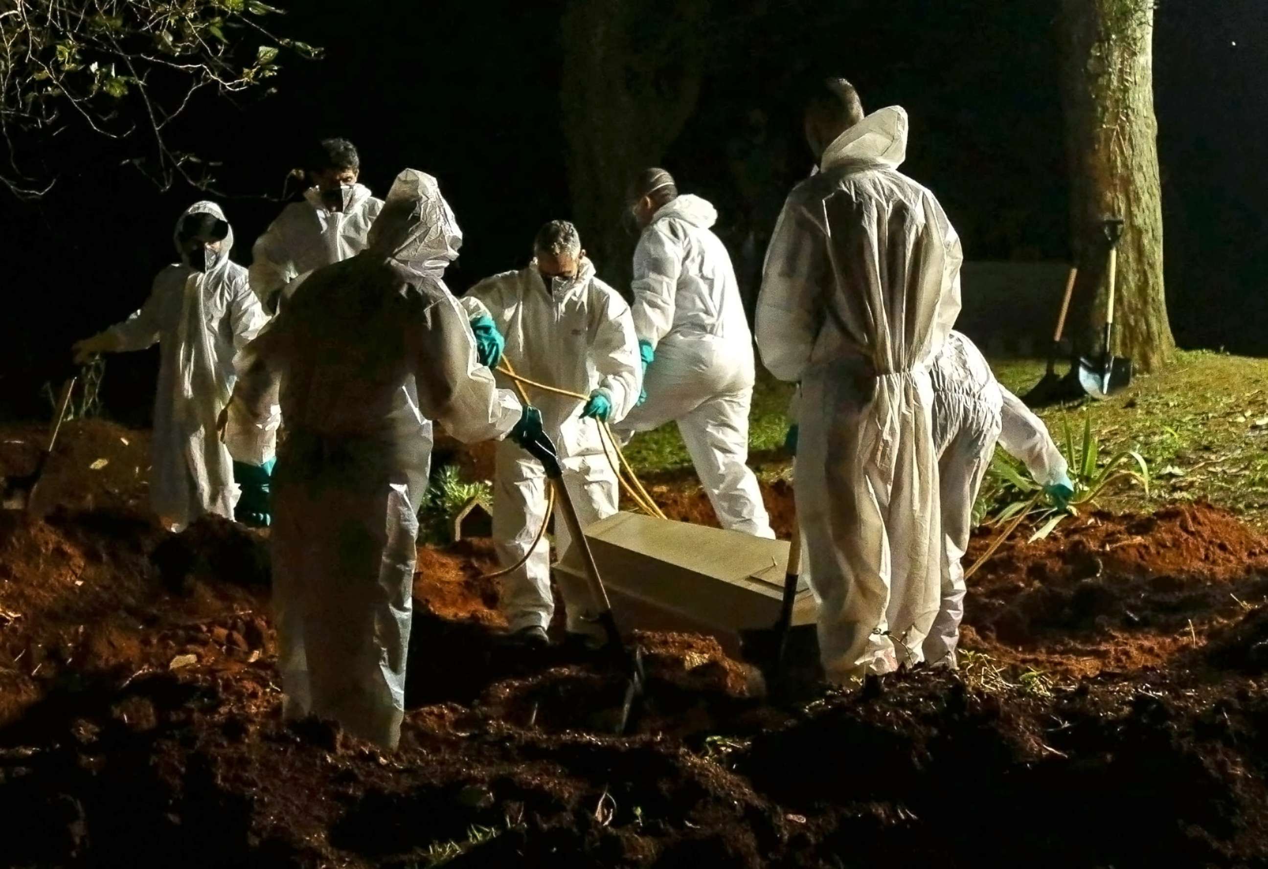 PHOTO: A coffin is buried at the Vila Formosa cemetery in Sao Paulo, Brazil, on March 31, 2021, amid the novel coronavirus COVID-19 pandemic.