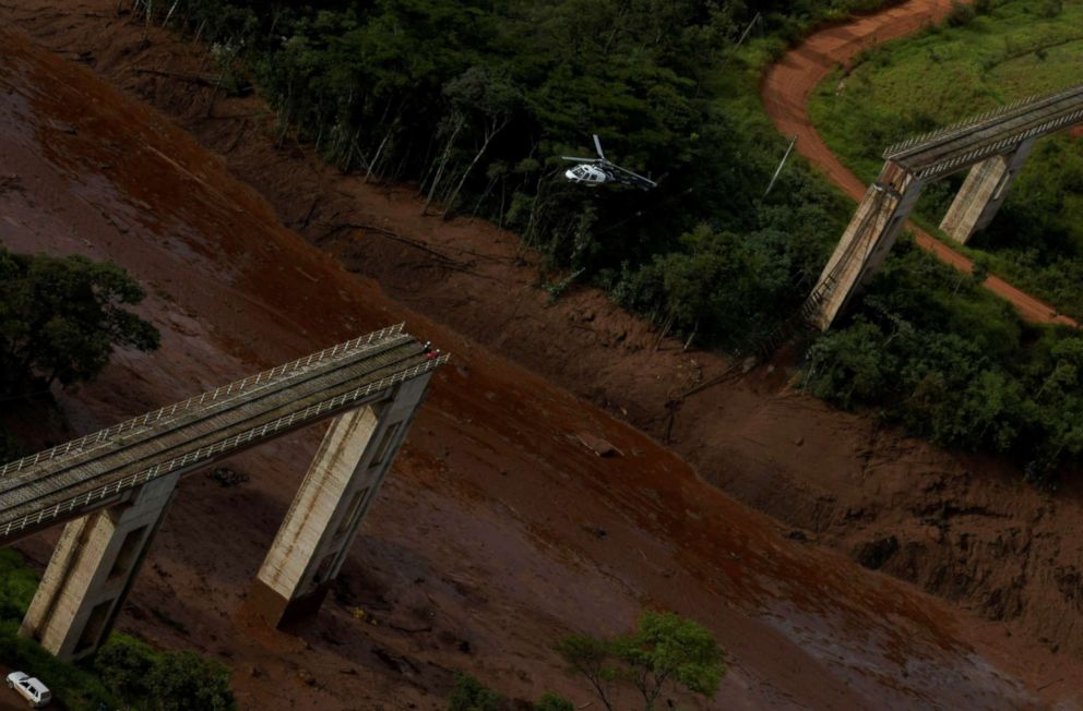  A helicopter flies over an area where a dam owned by Brazilian miner Vale SA burst, in Brumadinho, Brazil, Jan. 25, 2019. 
							