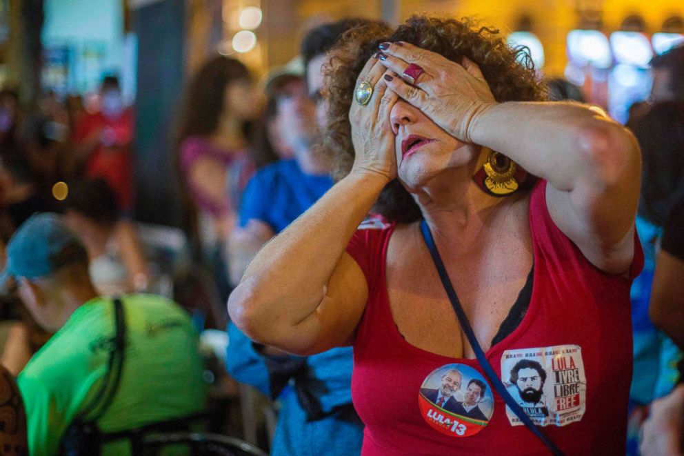 PHOTO: A supporter of Brazilian presidential candidate for the Workers' Party Fernando Haddad reacts during the general election vote count, in the South Zone of Rio de Janeiro, on Oct. 7, 2018.