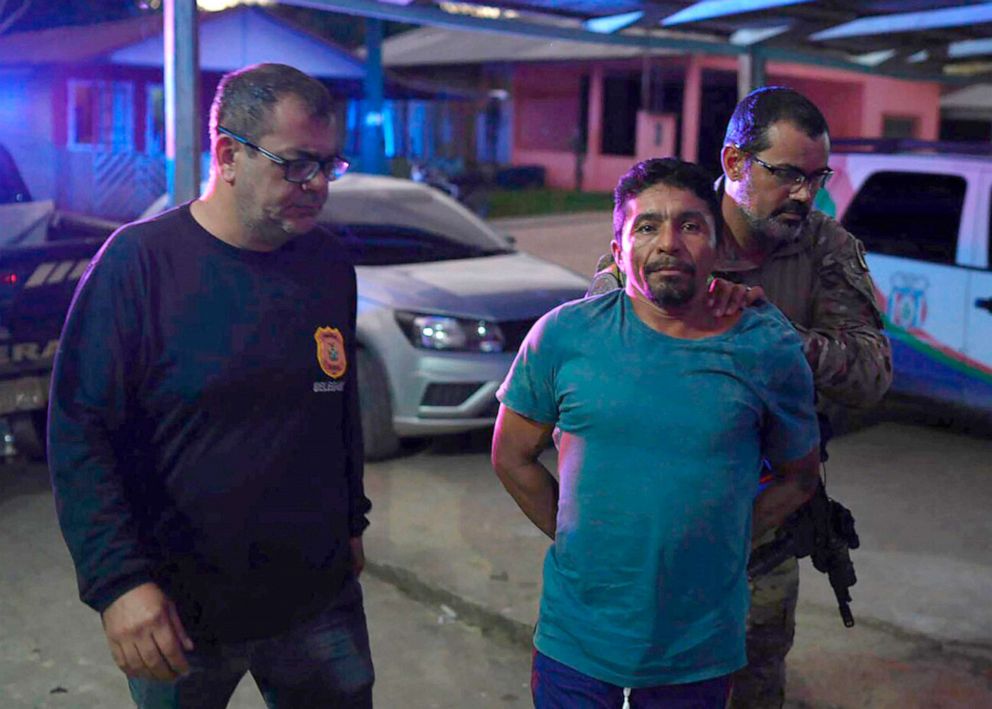 PHOTO: Oseney da Costa de Oliveira, 41, is escorted by Federal Police officers to a police station in Atalia do Norte, Amazonas state, Brazil, June 14, 2022.