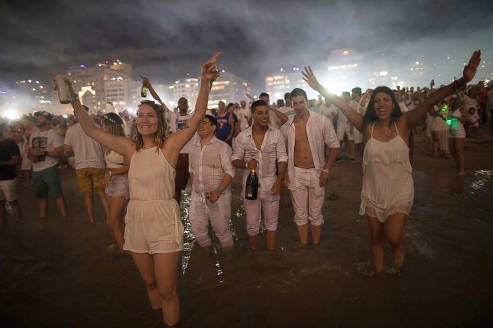 PHOTO: People watch fireworks exploding over Copacabana beach during New Year's celebrations in Rio de Janeiro, Brazil, Jan. 1, 2018. 