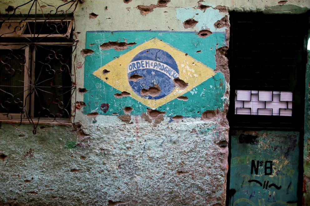 PHOTO: A mural of the Brazilian flag is damaged by bullet holes in Jacarezinho in Rio de Janeiro, Jan. 10, 2018.