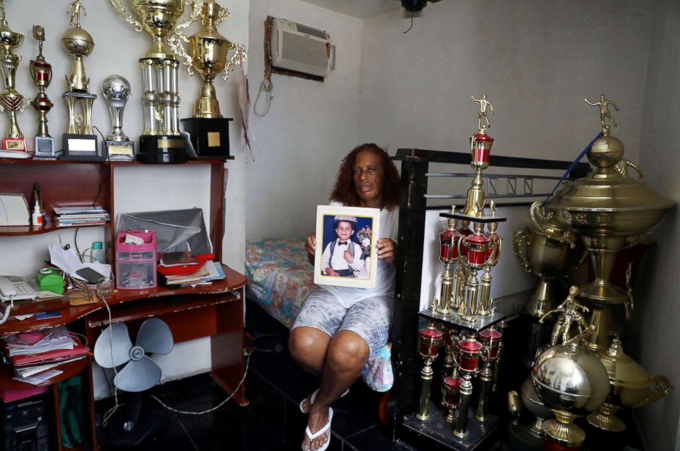 PHOTO: Maria Dalva Correia da Silva holds a photo of her son Thiago, who was killed in Borel in Rio de Janeiro, April 22, 2018.