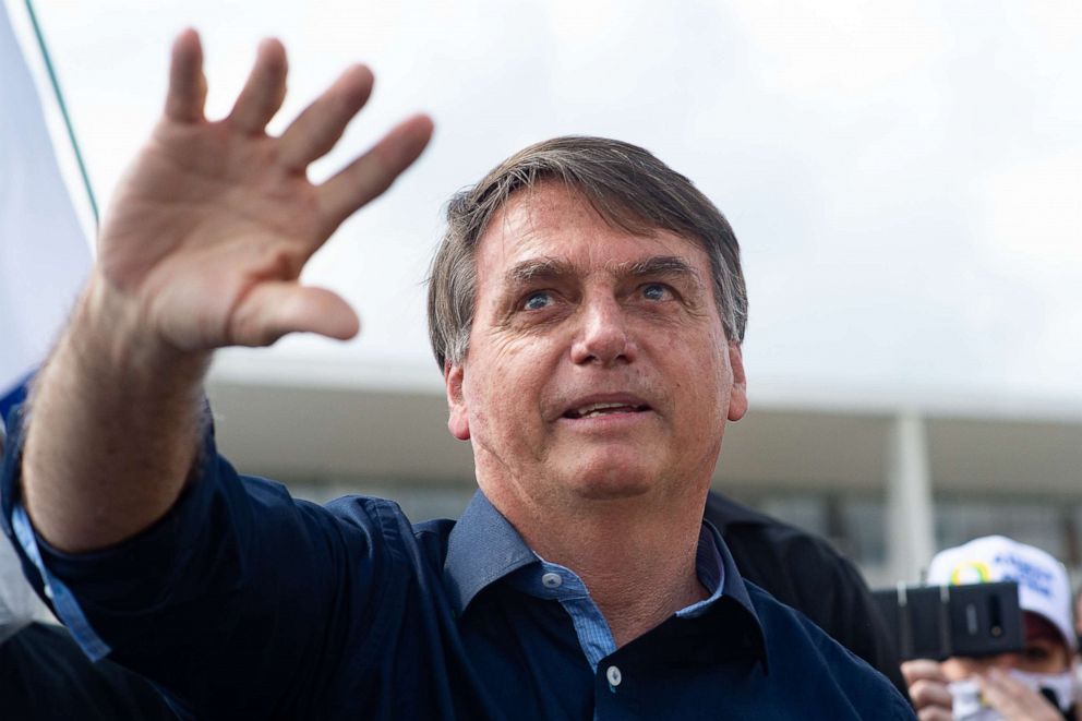 PHOTO: Brazilian President Jair Bolsonaro waves during a demonstration in favor of his government amid the coronavirus pandemic in front of Planalto Palace in the capital, Brasilia, May 24, 2020.