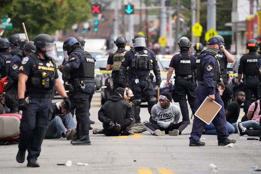 PHOTO: Louisville police detain a a group who marched, Sept. 23, 2020, in Louisville, Ky. A grand jury has indicted one officer on criminal charges six months after Breonna Taylor was fatally shot by police in Kentucky.