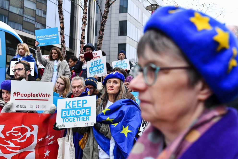 PHOTO: Demonstrators hold signs as they protest outside an EU summit in Brussels, , Nov. 25, 2018. European Union leaders are gathering to seal an agreement on Britain's departure from the bloc next year.