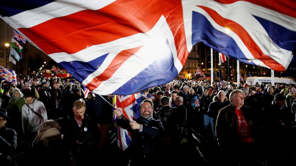 PHOTO: A man waves a British flag on Brexit day in London, Jan. 31, 2020. 