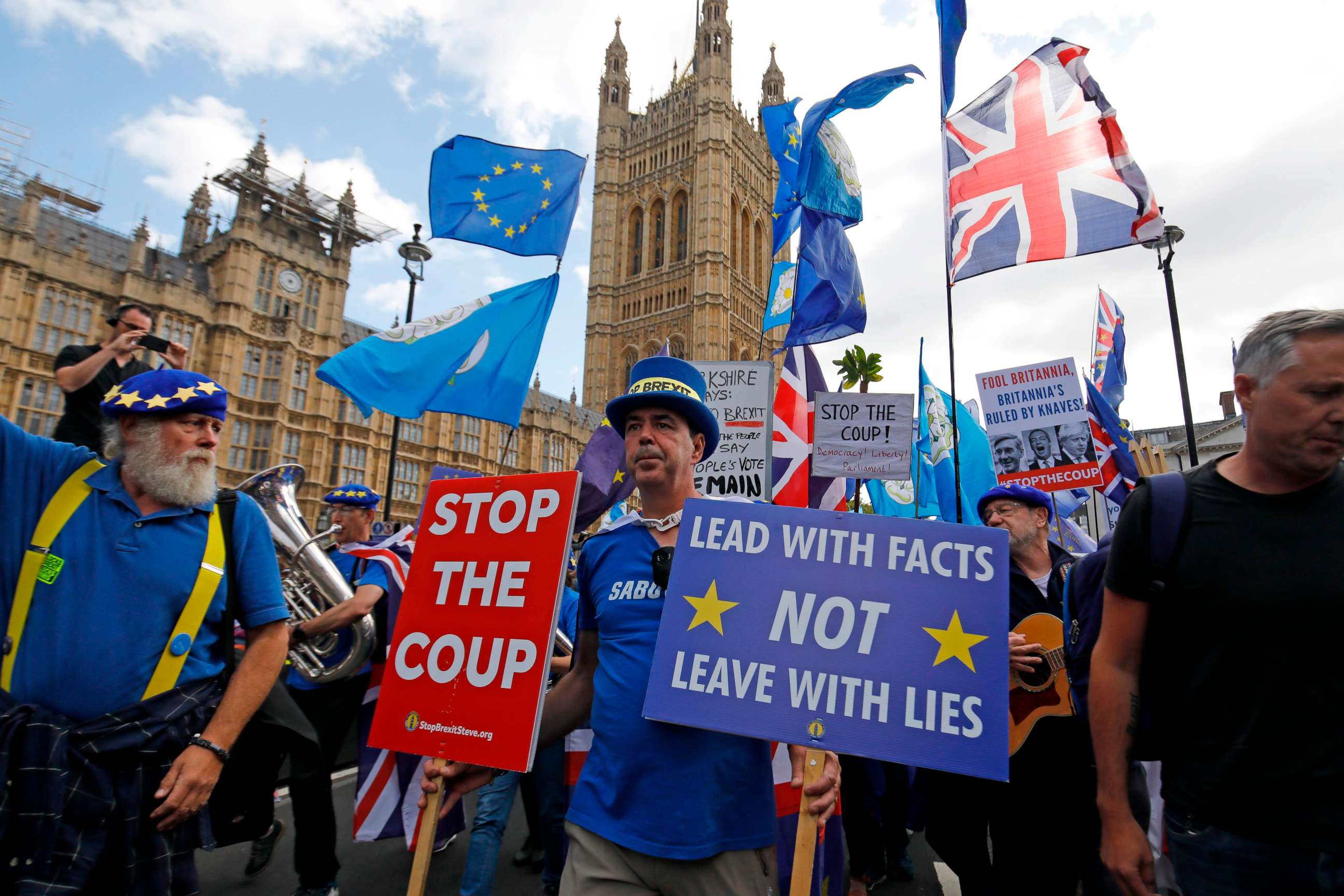 PHOTO: Anti-Brexit protesters march outside the Houses of Parliament in central London on September 3, 2019.