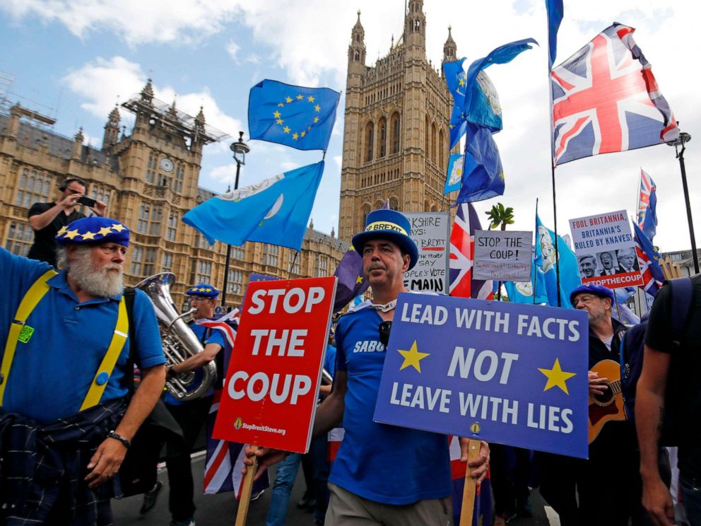 PHOTO: Anti-Brexit protesters march outside the Houses of Parliament in central London on September 3, 2019.