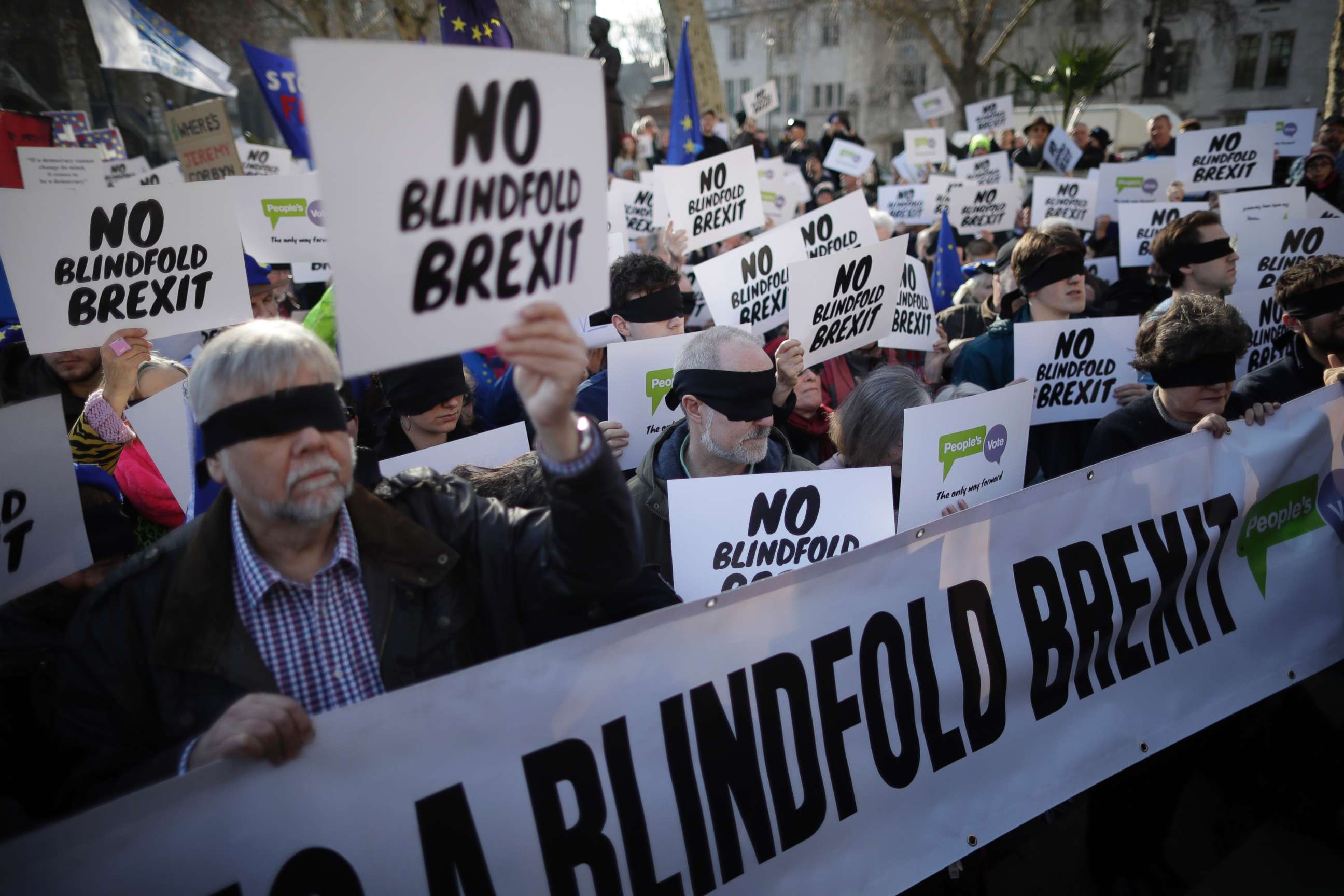 PHOTO: Anti-Brexit activists wear blindfolds as they take part in a protest event organised by the People's Vote Campaign, which calls for a second referendum on Britain's EU membership, in Parliament Square, London, Feb. 14, 2019.
