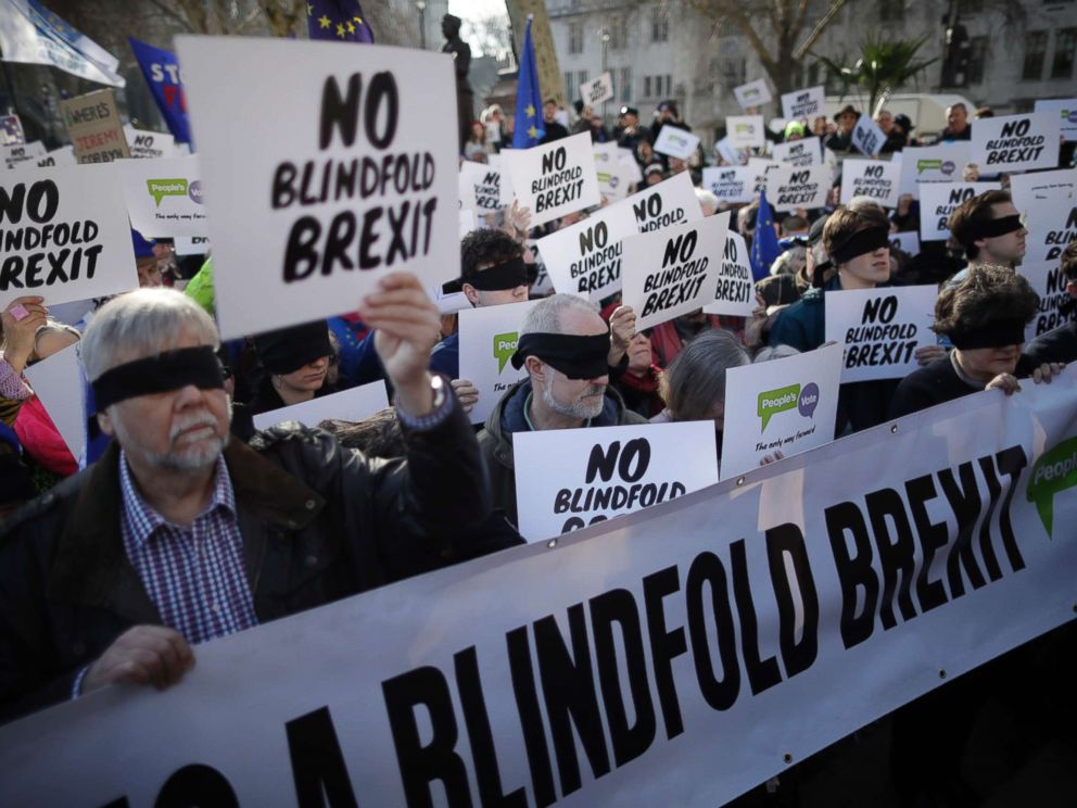 PHOTO: Anti-Brexit activists wear blindfolds as they take part in a protest event organised by the Peoples Vote Campaign, which calls for a second referendum on Britains EU membership, in Parliament Square, London, Feb. 14, 2019.