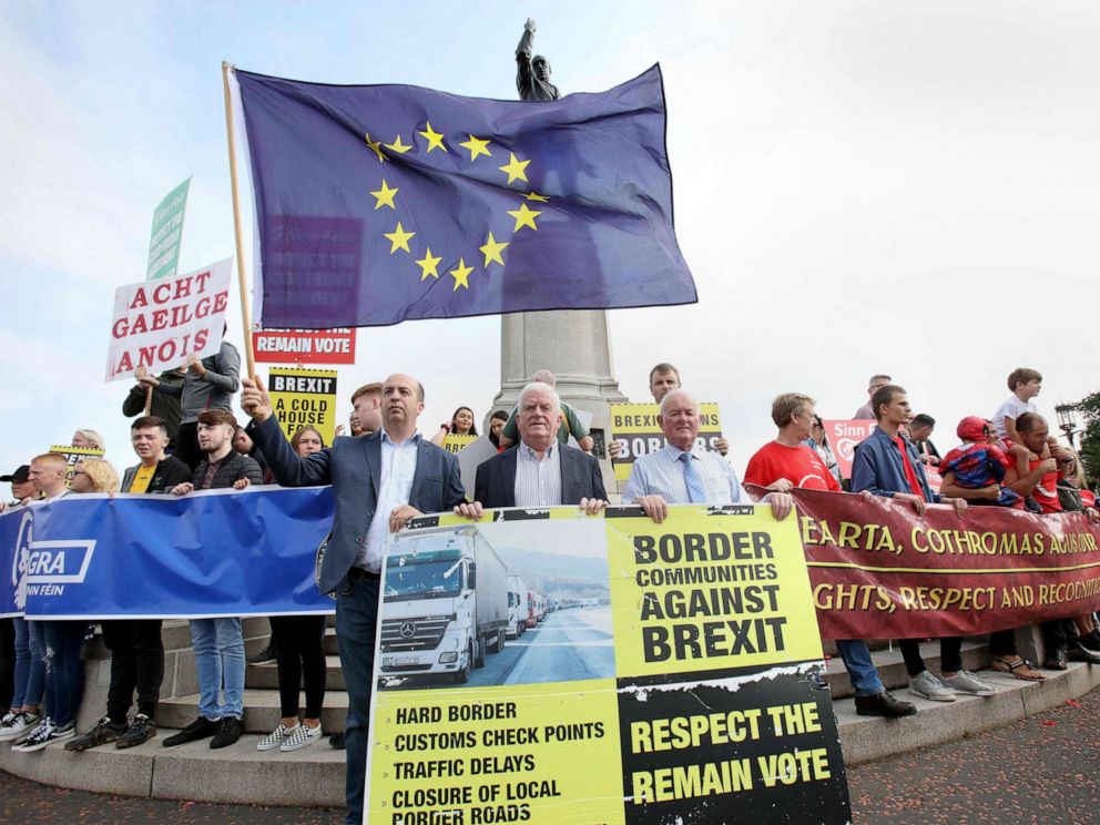 PHOTO: Anti-Brexit demonstrators protest outside Stormont house as Britains Prime Minister Boris Johnson visits Belfast on July 31, 2019.