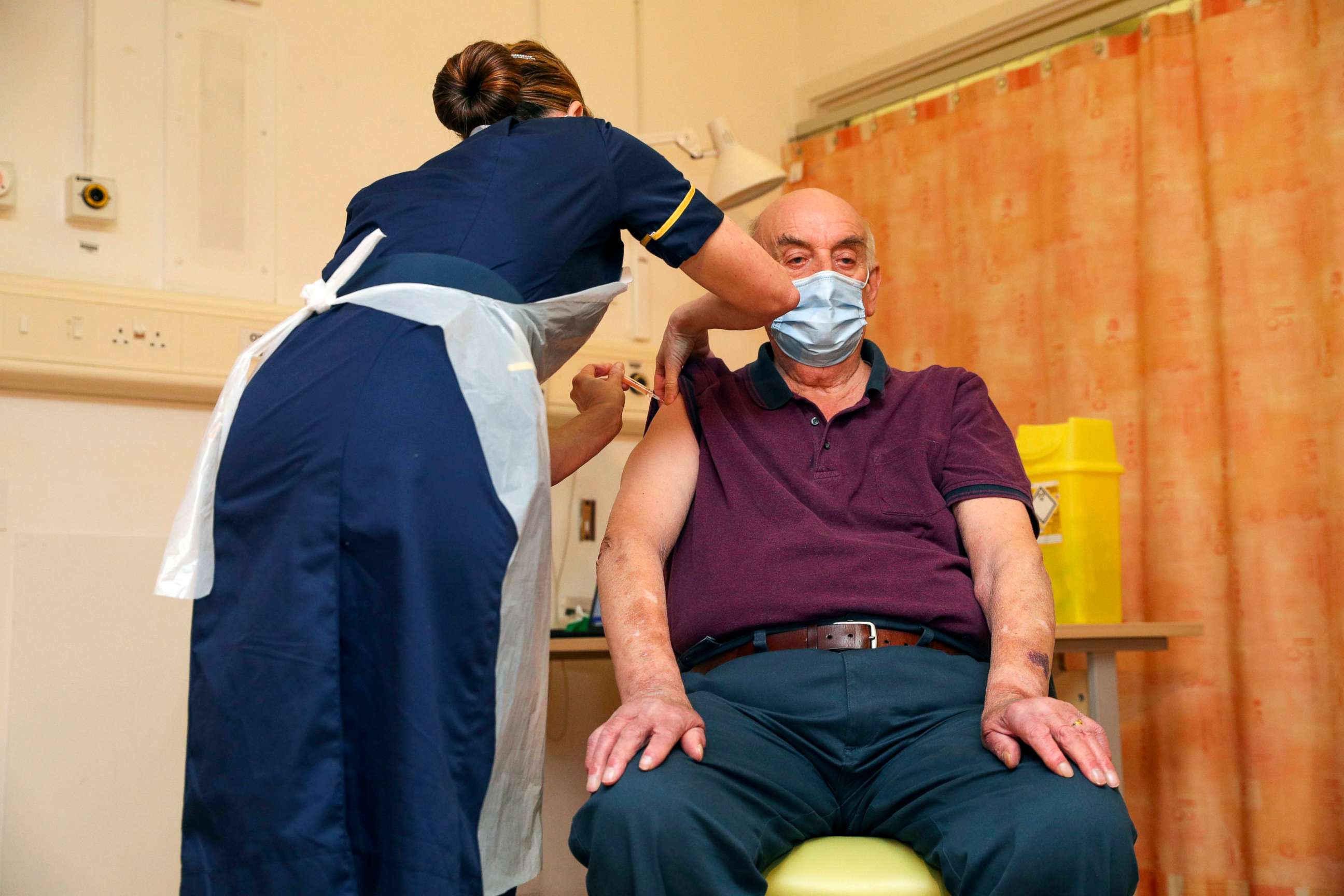 PHOTO: Brian Pinker, 82, receives the Oxford/AstraZeneca COVID-19 vaccine from chief nurse Sam Foster at Churchill Hospital in Oxford, England, on Jan. 4, 2021.