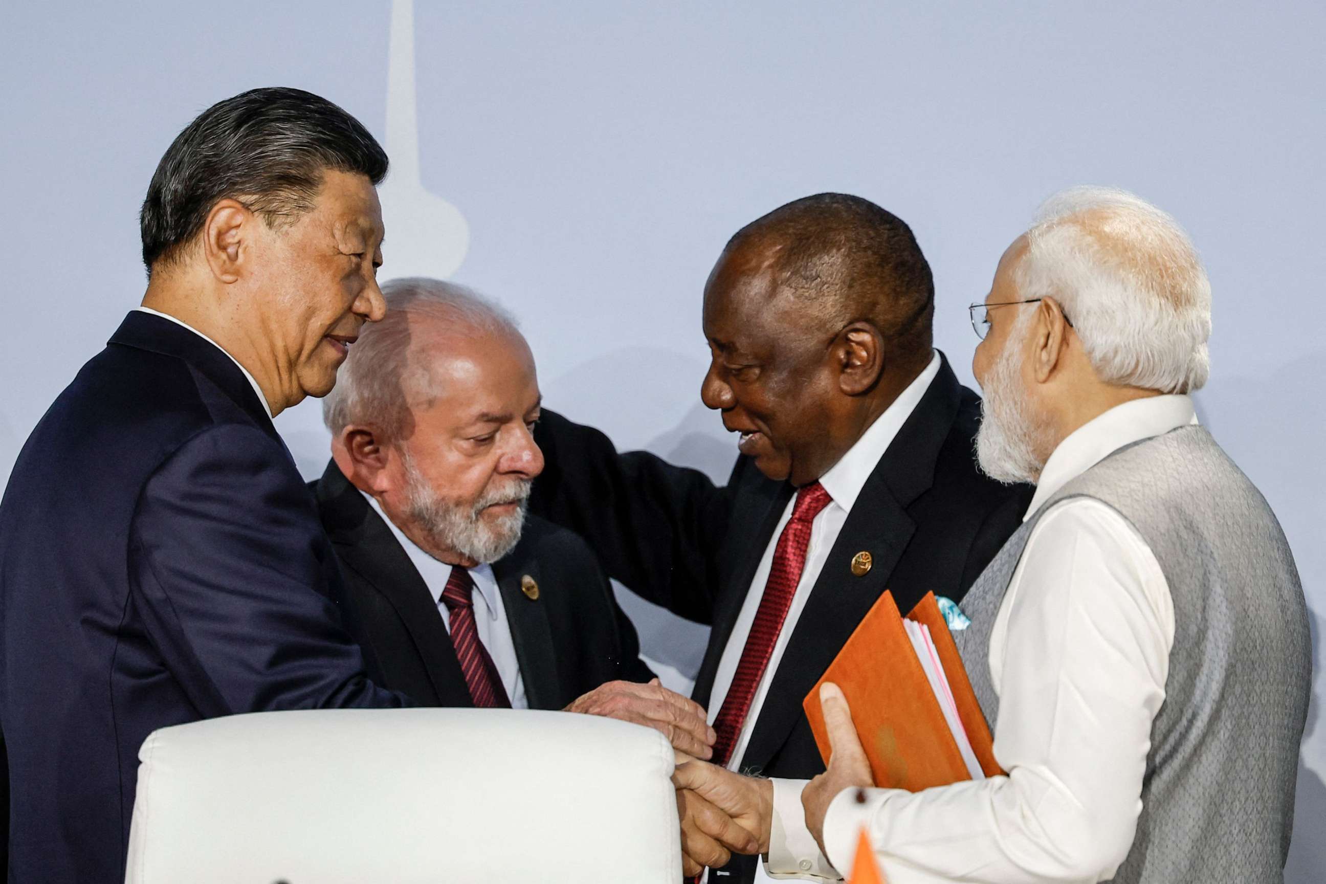 PHOTO: President of China Xi Jinping, President of Brazil Luiz Inacio Lula da Silva, South African President Cyril Ramaphosa and Prime Minister of India Narendra Modi gesture during the 2023 BRICS Summit in Johannesburg on August 24, 2023.
