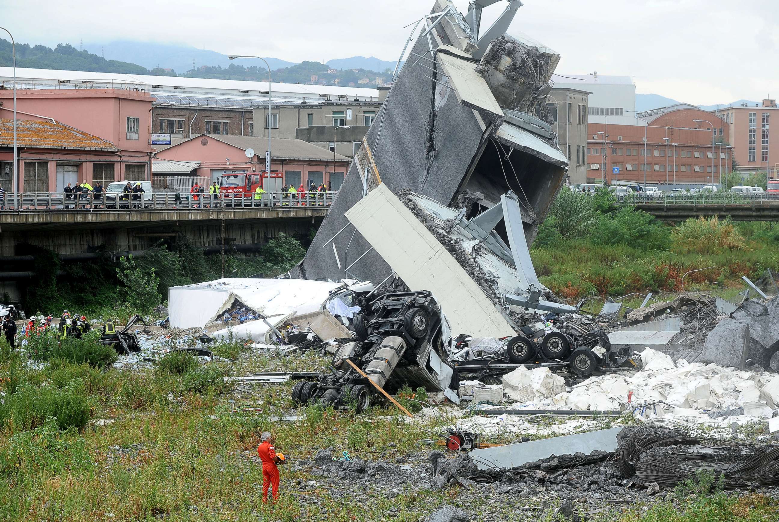 PHOTO: Rescuers work at the scene of the collapsed Morandi Bridge in the Italian port city of Genoa, Italy Aug. 14, 2018.