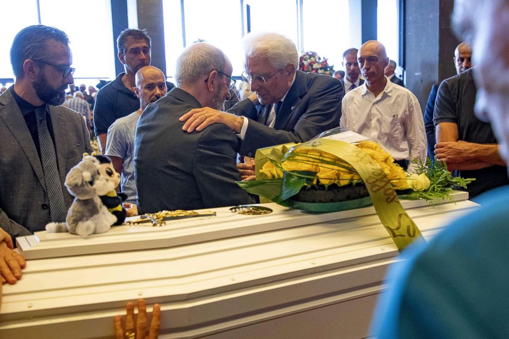 PHOTO: Italian President Sergio Mattarella (R) as he meets relatives of victims before attending the State funeral after the collapse of the Morandi bridge, in Genoa, Aug. 18, 2018.