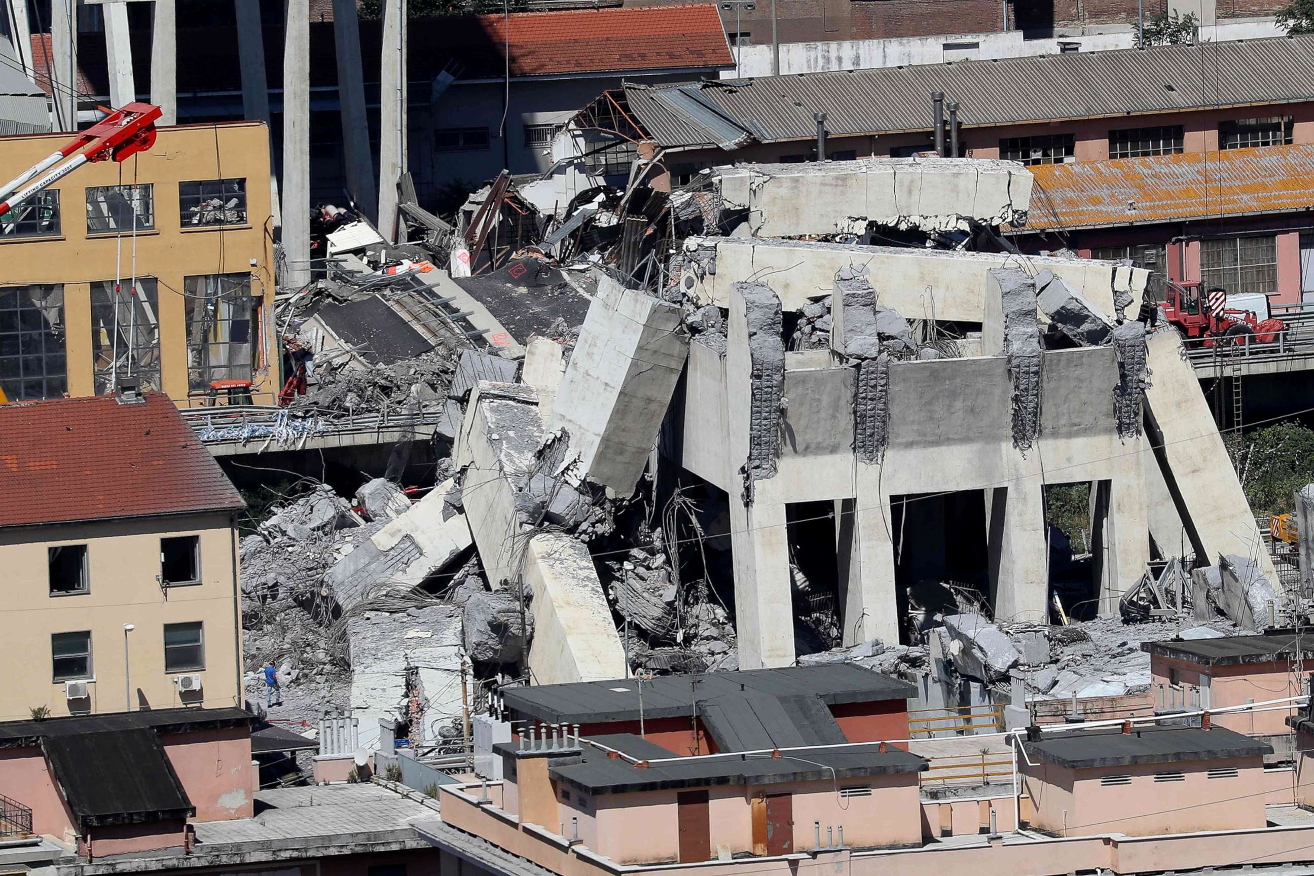 PHOTO: Rubble of the collapsed section of the Morandi bridge the day after the accident Genoa, Italy, Aug, 15, 2018.