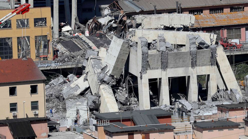 PHOTO: Rubble of the collapsed section of the Morandi bridge the day after the accident Genoa, Italy, Aug, 15, 2018.