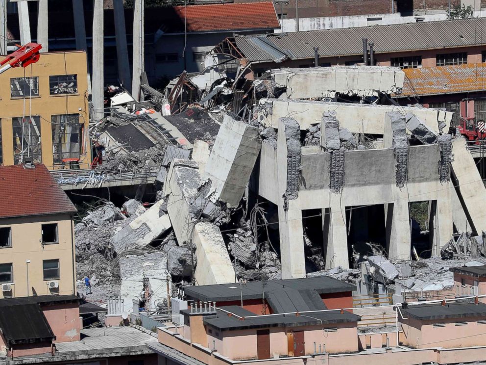 PHOTO: Rubble of the collapsed section of the Morandi bridge the day after the accident Genoa, Italy, Aug, 15, 2018.