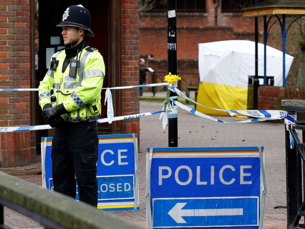 PHOTO: A police officer stands on duty at a cordon near a bench covered in a protective tent at The Maltings shopping centre in Salisbury, southern England, on March 12, 2018, where a man and woman were found critically ill.