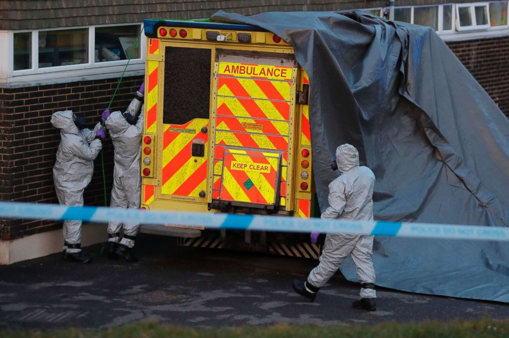 PHOTO: Personnel in protective coveralls and breathing equipment cover an ambulance with a tarpaulin to be taken away by military personnel at the Salisbury District Hospital in Salisbury, England, March 10, 2018.