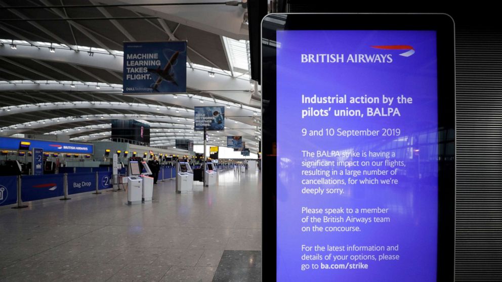 PHOTO:A screen gives information about the British Airways pilots' strike in Terminal 5 at Heathrow Airport in London, which handles British Airways flights, Sept. 9, 2019.