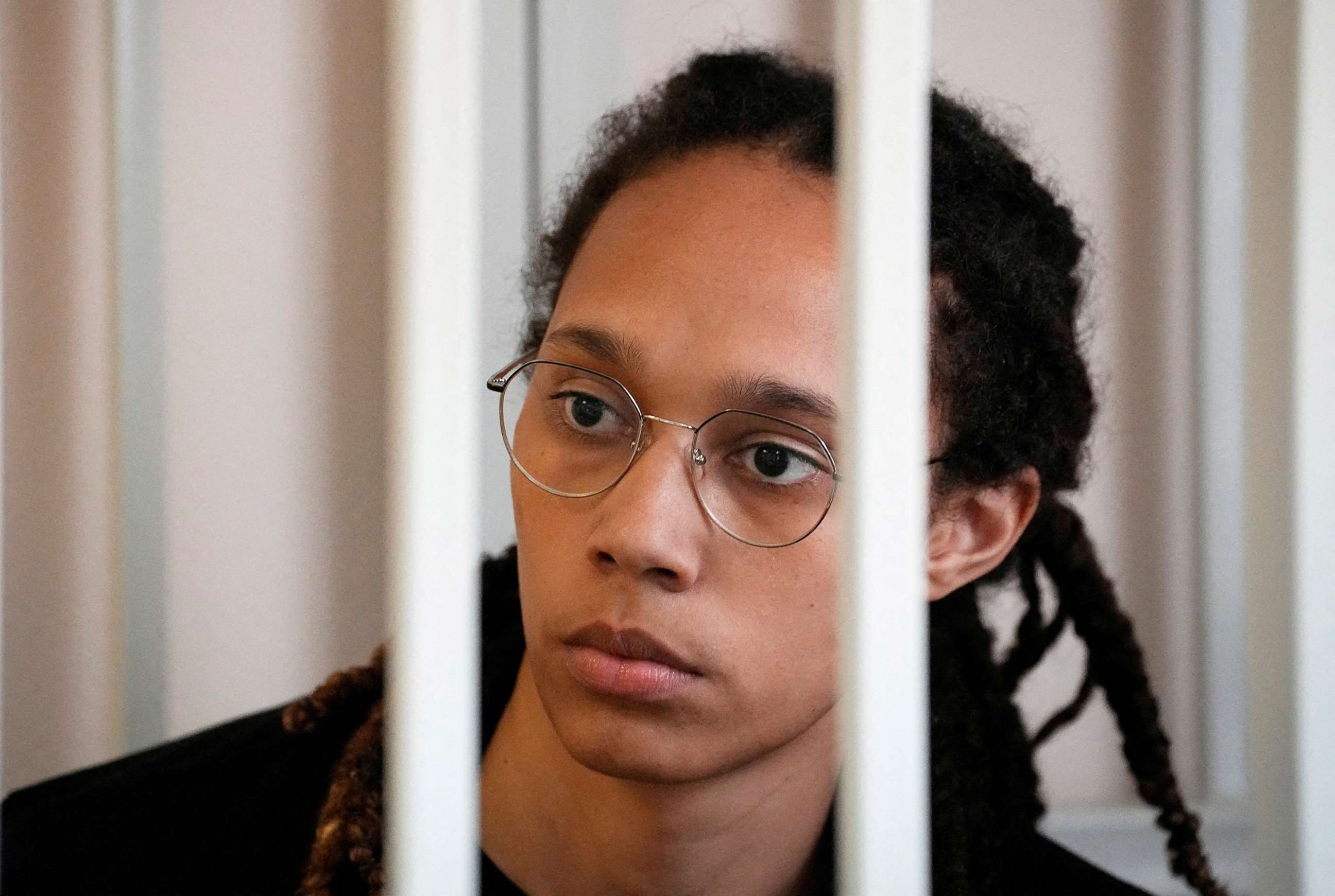 PHOTO: WNBA star and two-time Olympic gold medalist Brittney Griner sits in a cage at a court room prior to a hearing, in Khimki, Russia, July 27, 2022.