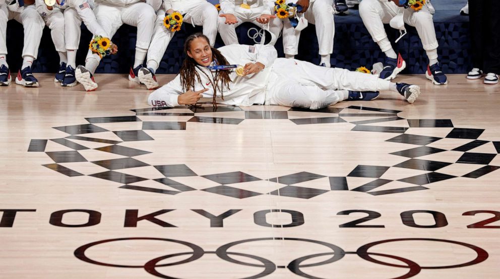 PHOTO: In this Aug. 8, 2021, file photo, Brittney Griner of the United States poses with her Tokyo 2020 Olympic women's basketball teammates after winning the gold medal, at Saitama Super Arena in Saitama, Japan.
